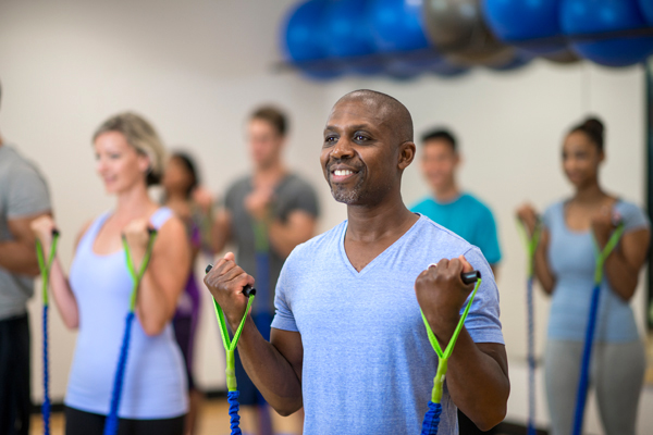 man exercising with bands